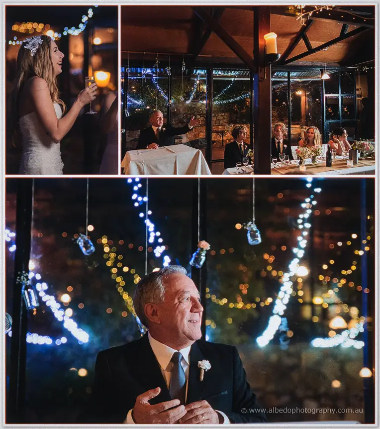 Tara laughs during the speeches while a groomsman raises his glass beneath hanging jar lanterns