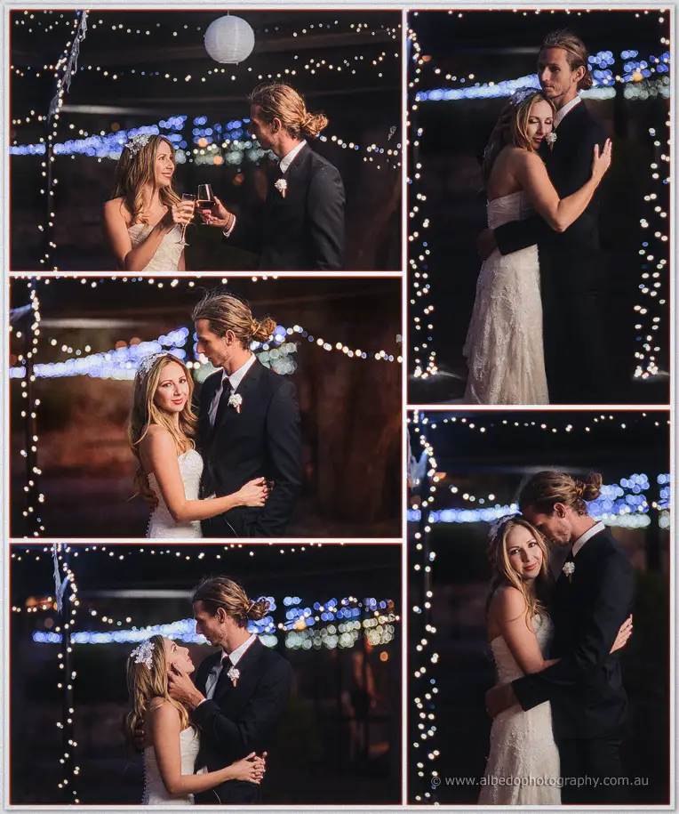 Tara and Stephen toast with champagne beneath strung fairy lights after dark