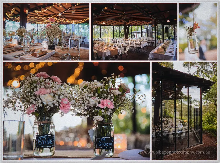 Bride and groom chalkboard jars of pink carnations and baby's breath dress the pavilion tables