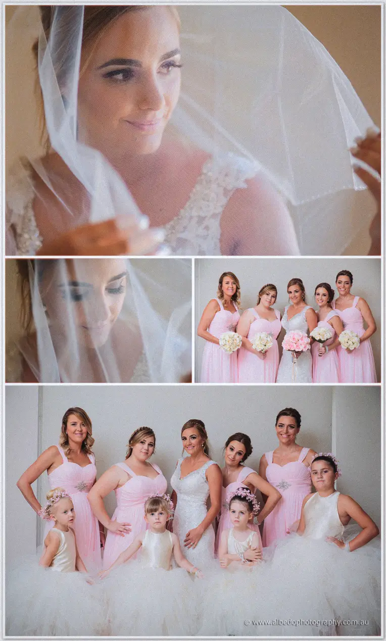 Veil draped overhead, Tarmecca's soft portrait is joined by her bridesmaids lined up in pink with bouquets.