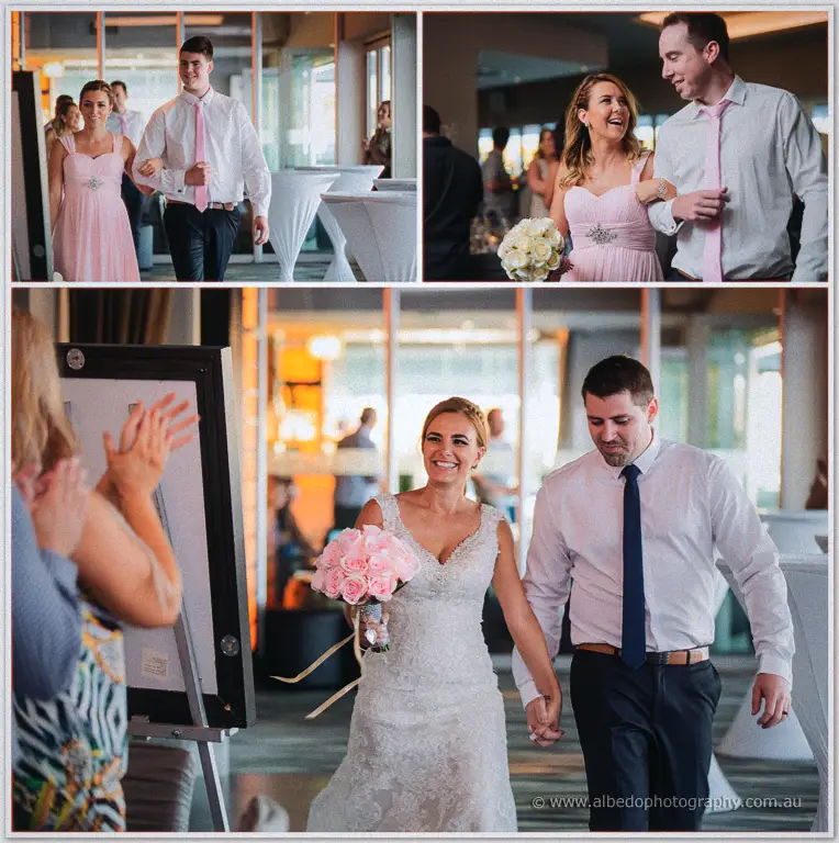 Wedding party processions at the Akoya Suite as Tarmecca and Lee enter hand in hand to applause
