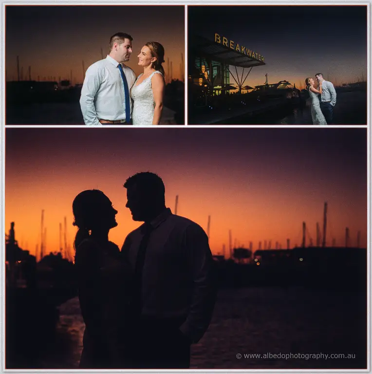 Sunset silhouettes the couple forehead to forehead as masts fade behind them at Hillarys marina