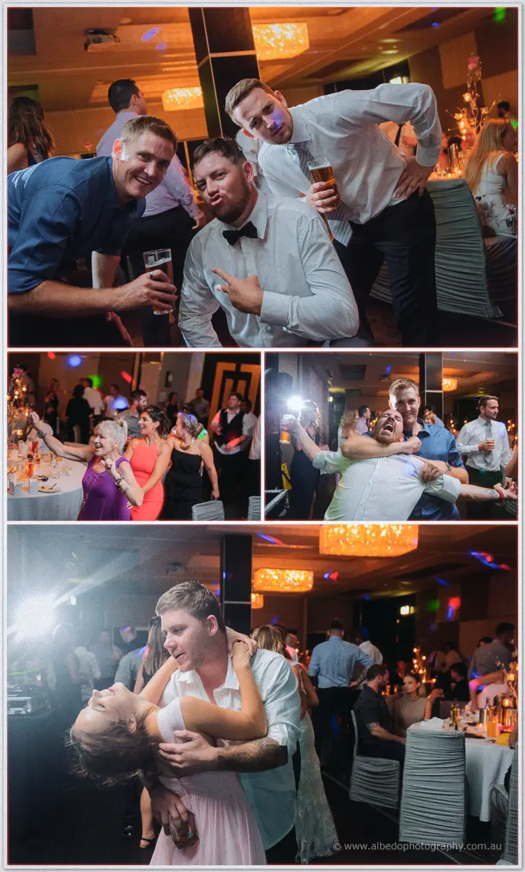 Guests mug for the camera and dip each other on the dance floor beneath the ballroom's chandeliers