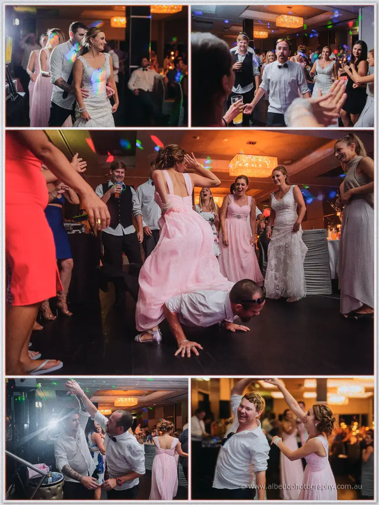 Packed dance floor under party lights as guests twirl, piggyback and laugh at the Akoya Suite reception