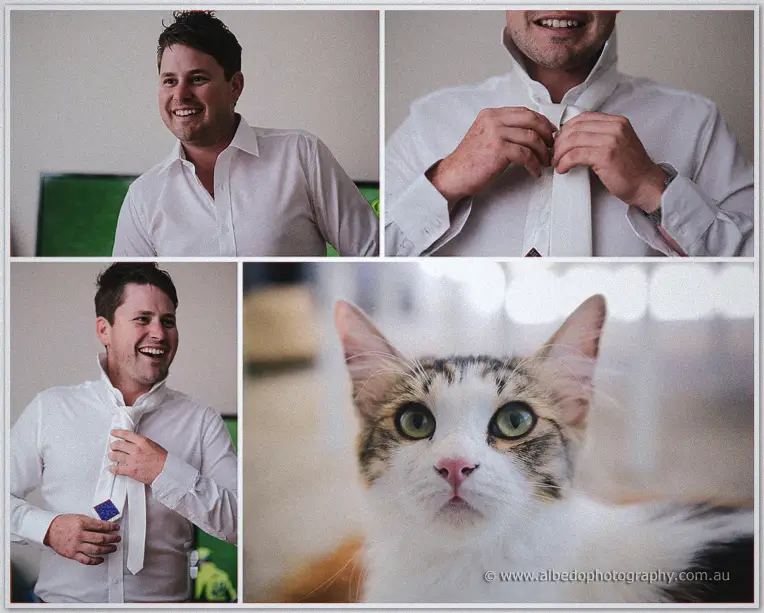 Michael grinning while fastening his tie in a white shirt before the Fairbridge ceremony