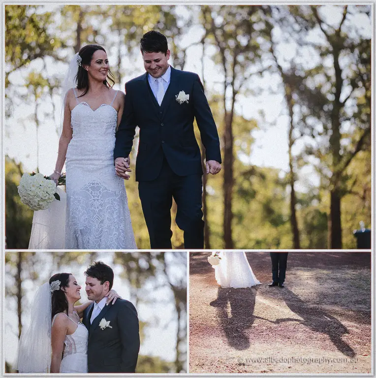 Prue and Michael strolling hand in hand along a gravel track between summer trees