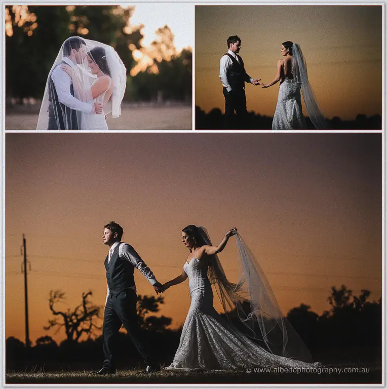 Prue and Michael silhouetted against a burning sunset, her veil drifting across them both