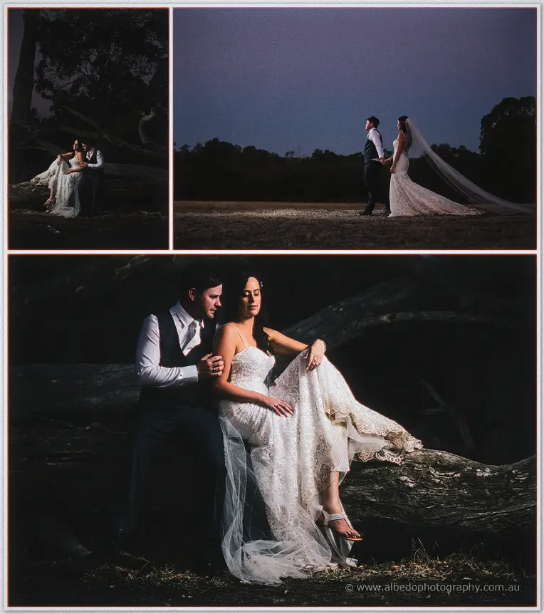 Michael helping Prue down from a fallen log in moody night-light at Fairbridge