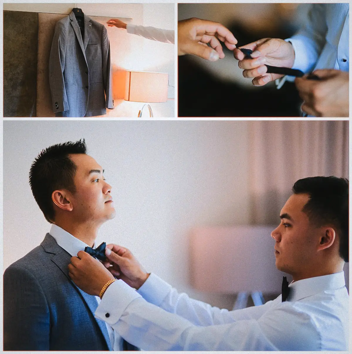 A groomsman helps Andrew with his bow tie beside his grey suit in the hotel room