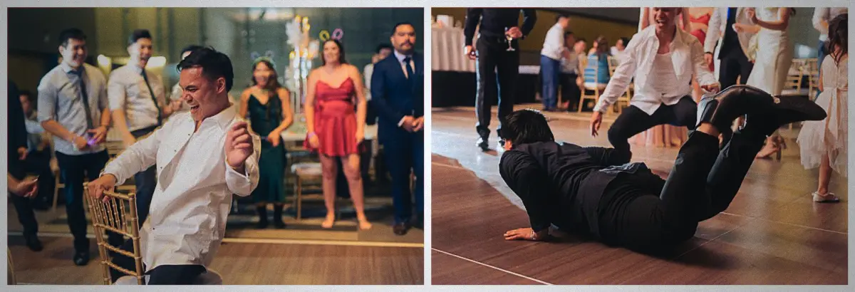 A guest drops into a breakdance spin on the floor while wedding friends cheer him on.