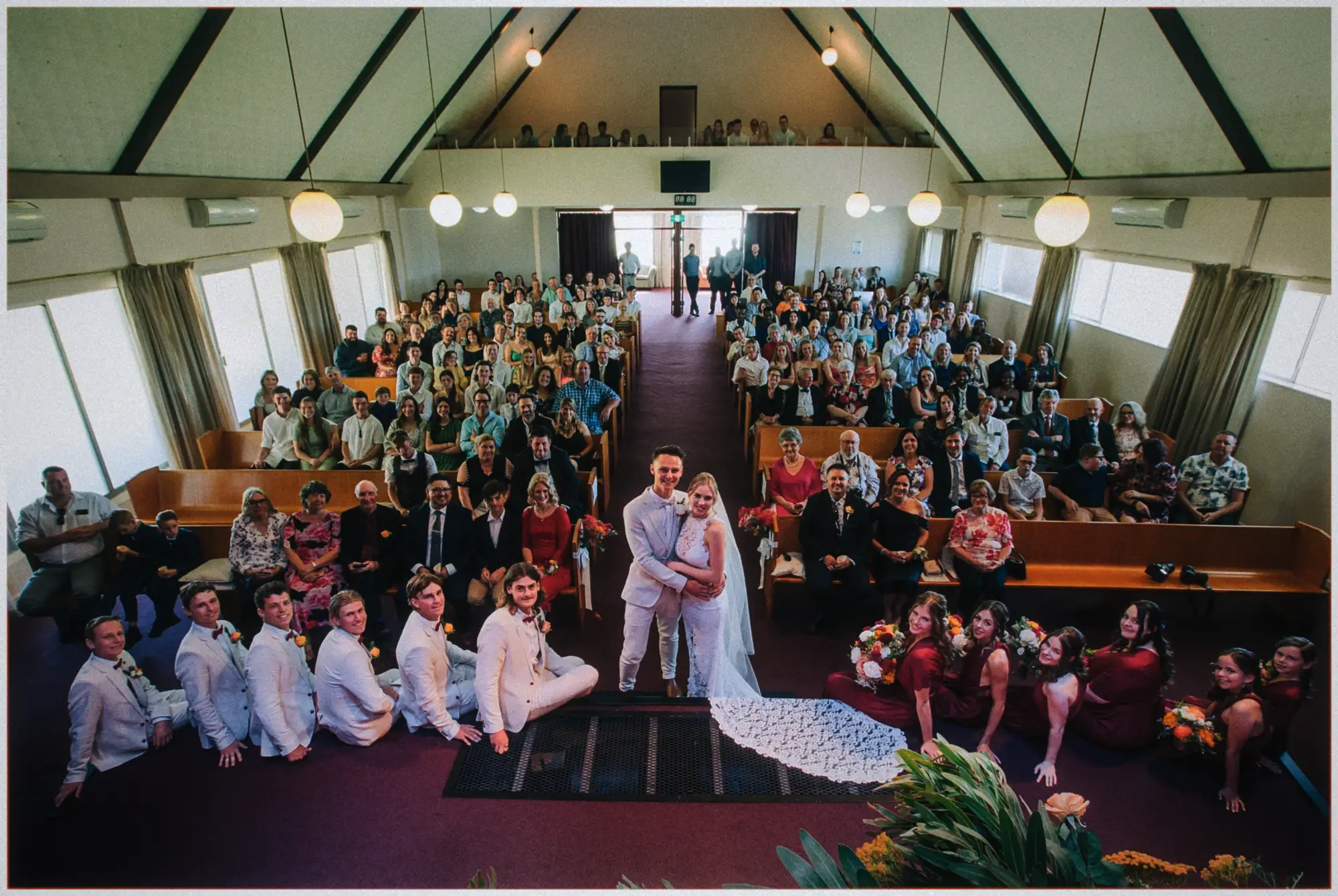 Whole congregation and bridal party packed into the chapel with Erin and Justin front and center.