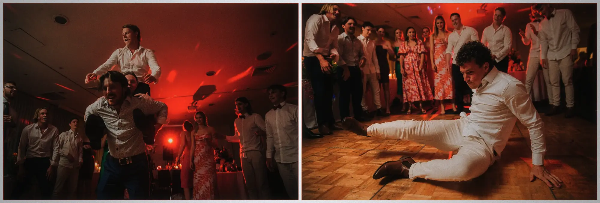 Groomsman carrying a laughing guest on his shoulders while another slides low across the red-lit dance floor