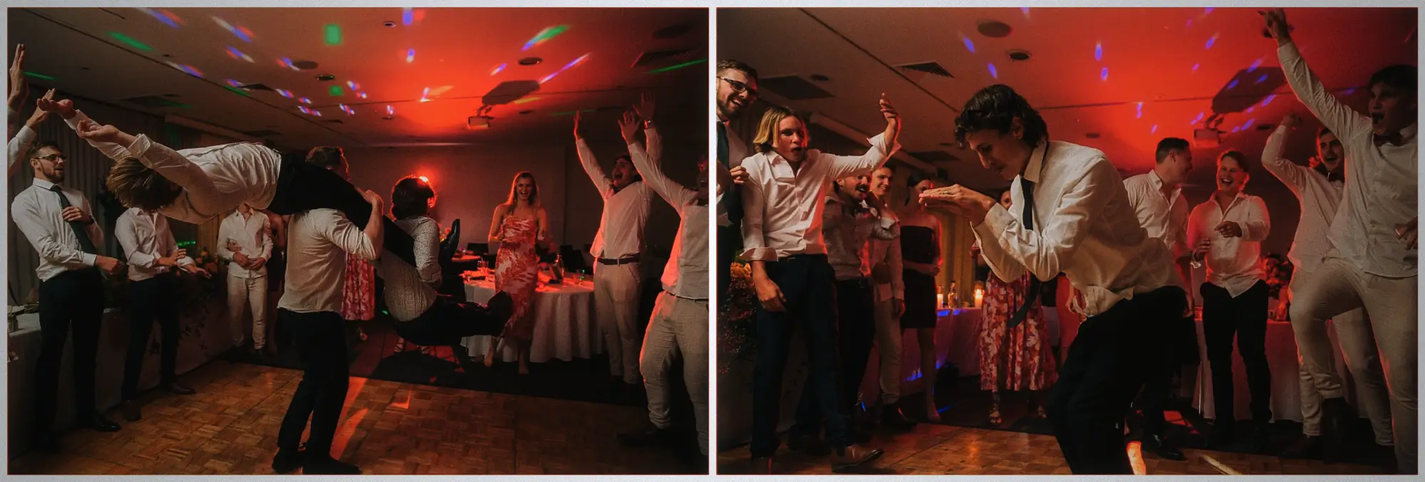 Guests hoisting a friend over their shoulders as the crowd cheers in the red-lit reception room